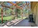 Outdoor deck and pergola with views of the lush, forested backyard at 29551 Dorothy Rd, Evergreen, CO 80439