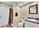 Bathroom featuring a walk-in shower and white vanity at 29551 Dorothy Rd, Evergreen, CO 80439