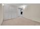 Bedroom with neutral carpet, white walls, and a large closet at 29551 Dorothy Rd, Evergreen, CO 80439