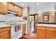 This kitchen has wood cabinets, white countertops, and views into adjacent living areas at 29551 Dorothy Rd, Evergreen, CO 80439