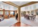 Open concept living room and dining room with hardwood trim and large windows at 29551 Dorothy Rd, Evergreen, CO 80439