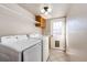 Functional laundry room with washer, dryer, and exterior access at 1626 Adobe Pl, Highlands Ranch, CO 80126