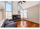 Vaulted ceiling living room with a fireplace and hardwood floors at 1626 Adobe Pl, Highlands Ranch, CO 80126