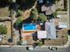 An overhead view of a home with a sparkling pool, an outdoor area, and a secure fence at 2141 W Gill Pl, Denver, CO 80223