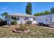 Charming single-story home featuring a well-manicured front yard and inviting entrance at 2141 W Gill Pl, Denver, CO 80223