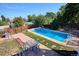 Inviting backyard features a pristine pool and pleasant patio area at 2141 W Gill Pl, Denver, CO 80223