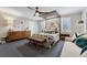Bedroom featuring a bed with neutral bedding, a ceiling fan, and herringbone carpet at 4032 S Olive St, Denver, CO 80237