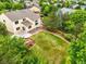 Aerial view of backyard with a water feature and a large lawn, surrounded by mature trees at 6364 S Walden Ct, Aurora, CO 80016