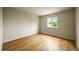 Bedroom with hardwood floors and natural light from the window at 6364 S Walden Ct, Aurora, CO 80016