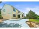 Back exterior view of a two-story home, showing a concrete patio and a landscaped backyard at 6364 S Walden Ct, Aurora, CO 80016