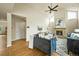 Bright living room with vaulted ceilings, fireplace, and hardwood floors at 6364 S Walden Ct, Aurora, CO 80016