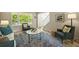 Bright living room with comfortable seating, large windows, and stylish decor at 6364 S Walden Ct, Aurora, CO 80016