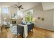 Inviting living room with fireplace, large windows, and vaulted ceilings at 6364 S Walden Ct, Aurora, CO 80016