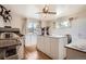 Bright bonus room with natural light, wooden floors, cabinets, and ample workspace at 4585 Garrison St, Wheat Ridge, CO 80033
