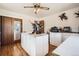 Spacious bonus room with hardwood floors, featuring mounted ducks and ample storage space at 4585 Garrison St, Wheat Ridge, CO 80033