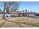 Beautiful single-story home with a classic brick facade and well-manicured front lawn at 4585 Garrison St, Wheat Ridge, CO 80033