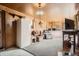 Spacious living room with wood paneled walls, and carpeted floors at 4585 Garrison St, Wheat Ridge, CO 80033