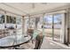 Bright screened porch with seating area and view of the backyard at 4585 Garrison St, Wheat Ridge, CO 80033