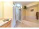 Bathroom boasting a soaking tub with tiled surround and separate walk-in shower at 6001 S Yosemite St # B203, Greenwood Village, CO 80111