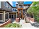 Courtyard view of townhouses with stairs and metal railings that lead to units above at 6001 S Yosemite St # B203, Greenwood Village, CO 80111