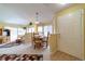 Cozy dining area with a wooden table set and natural light from surrounding windows at 6001 S Yosemite St # B203, Greenwood Village, CO 80111