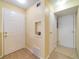 Welcoming entryway featuring tiled floors, white doors, and neutral-toned walls at 6001 S Yosemite St # B203, Greenwood Village, CO 80111