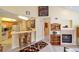 Open-concept living space with a kitchen, fireplace, and view of artwork at 6001 S Yosemite St # B203, Greenwood Village, CO 80111