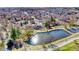 Aerial view of the property at 6882 Quail St, Arvada, CO, showcasing the surrounding neighborhood and a tranquil pond at 6882 Quail St, Arvada, CO 80004