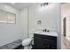 Bathroom featuring tiled shower and a black vanity at 6882 Quail St, Arvada, CO 80004