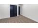 Carpeted bedroom with a closet with double doors and neutral walls at 6882 Quail St, Arvada, CO 80004