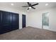 This bedroom has a ceiling fan, double closet, and access to the gorgeous tiled bathroom at 6882 Quail St, Arvada, CO 80004