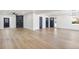 Large living room with fireplace and multiple entry doors at 6882 Quail St, Arvada, CO 80004