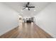 An empty living room with an open floor plan and wood-look floors at 6882 Quail St, Arvada, CO 80004