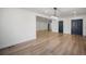 Spacious living area featuring hardwood floors, neutral paint, and an open layout at 6882 Quail St, Arvada, CO 80004