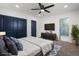 Comfortable main bedroom with closet, modern fixtures, and access to beautifully tiled bathroom at 6882 Quail St, Arvada, CO 80004