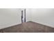 A cozy bedroom with carpeted floor and neutral colored walls in a lovely property at 6882 Quail St, Arvada, CO 80004