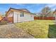 Spacious backyard featuring a well maintained lawn and partial fence at 206 River Rd, Platteville, CO 80651