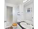 Cozy bathroom featuring a step-in shower, wood-accented toilet seat, and a sleek vanity with ample counter space at 206 River Rd, Platteville, CO 80651