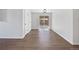 Dining room with hardwood floors and a sliding glass door to the backyard patio at 206 River Rd, Platteville, CO 80651