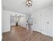Open floor plan with dining area leading to modern kitchen at 206 River Rd, Platteville, CO 80651