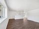 Spacious open floor plan featuring hardwood floors and plenty of natural light at 206 River Rd, Platteville, CO 80651