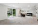 Finished basement with large glass sliding doors leading to the backyard at 5616 S Kenton Ct, Englewood, CO 80111