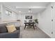 Finished basement with a desk area, a sofa, carpeting, and white walls at 5616 S Kenton Ct, Englewood, CO 80111