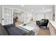 Finished basement space features a seating area and French doors to other rooms at 5616 S Kenton Ct, Englewood, CO 80111