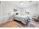 Cozy bedroom with natural light and a neutral color scheme at 5616 S Kenton Ct, Englewood, CO 80111