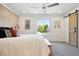 Spacious bedroom with barn door access and natural light at 5616 S Kenton Ct, Englewood, CO 80111