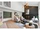 Open concept living room features a fireplace, tile accents, and natural light at 5616 S Kenton Ct, Englewood, CO 80111