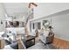Open concept living room and dining area offers vaulted ceilings and a staircase at 5616 S Kenton Ct, Englewood, CO 80111