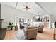 Inviting living room with vaulted ceilings and large windows for lots of natural light at 5616 S Kenton Ct, Englewood, CO 80111