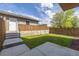 Backyard with lawn, concrete patio, and wooden fence at 2008 S Galapago St, Denver, CO 80223